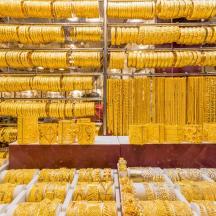 a display of gold bangles in a store