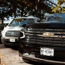 two trucks are parked in a parking lot