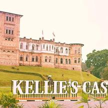 a castle with a sign in front of it