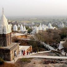 a view of a city with white domes and buildings