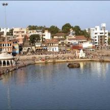 a city with a body of water with a town