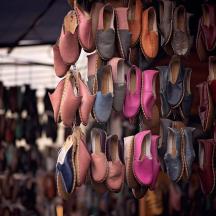 a bunch of shoes hanging on a wall