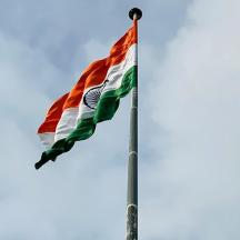 a flag on a pole in the sky