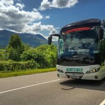 a bus is driving down a road