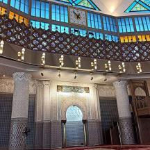 a large building with a ceiling and a balcony