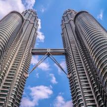 two tall buildings are next to each other