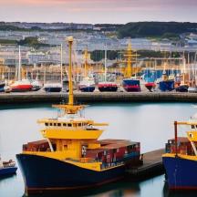 a group of boats docked in a harbor