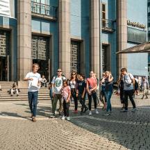 a group of people standing in front of a building
