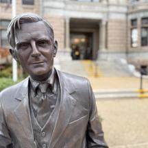a statue of a man in a suit and tie