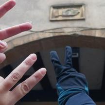 two people with their hands up in the air