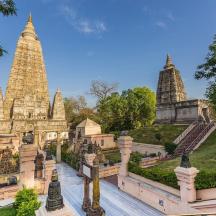 a view of a temple with towers in the background