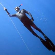 a person in a wetsuit in the water