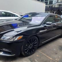 a black car parked in a parking lot