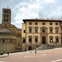 a large building with a clock tower and a cathedral
