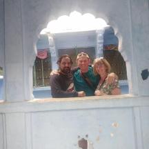 a group of three people standing in a play house