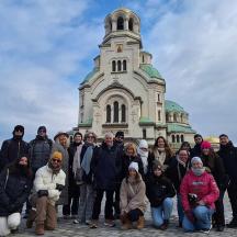 a group of people standing in front of a building