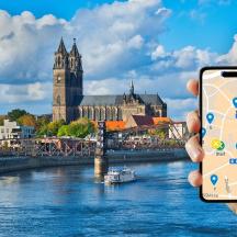 a person holding a cell phone taking a picture of a river