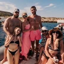 a group of people on a boat in the water