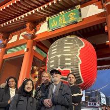 a group of people standing in front of a building