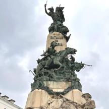 a statue of a woman on top of a tower