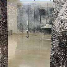 a room with black and white art on the walls