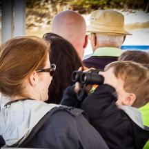 a woman taking a picture of a group of people