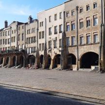 a row of buildings on a street in a city