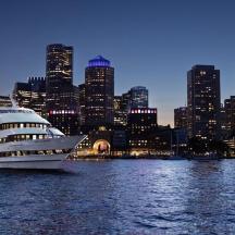 a cruise ship in the water in front of a city