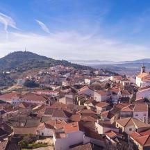 a view of a town with houses on a hill