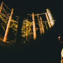 a person is looking at a window at night