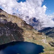a view of a mountain with a large blue lake