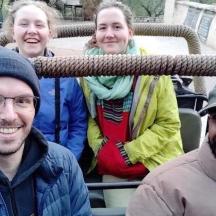 a group of people sitting in a truck