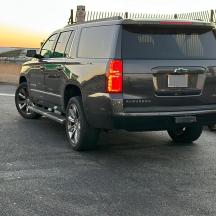a black suv parked in a parking lot