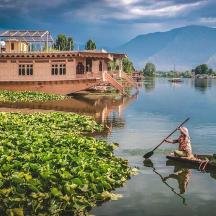a boat on a lake with a paddle in the water