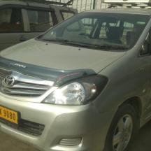 a silver car parked in a parking lot