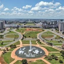 an aerial view of a city with a fountain