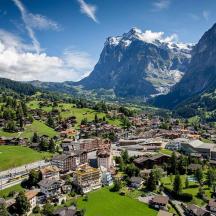 an aerial view of a town in the mountains