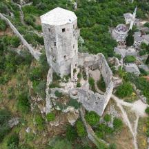 an old castle on the side of a hill