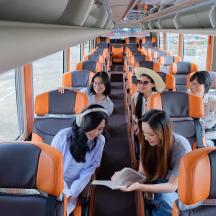 a group of people sitting on a bus