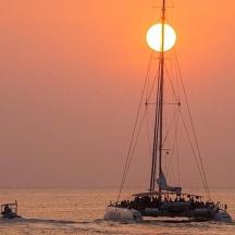 a group of people on a boat in the ocean