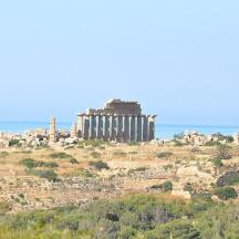 an ancient building on top of a hill