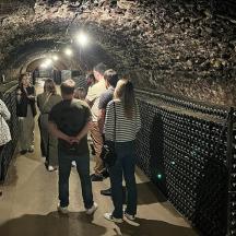 a group of people standing in a tunnel