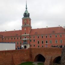 a large red brick building with a clock tower