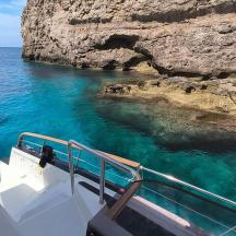 a boat in the ocean looking at the water