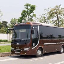 a brown bus is parked on a street