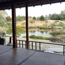 a view of a lake from a room with a window