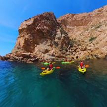 a group of people in kayaks in the water