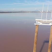 a boat sitting on top of a stand in the water