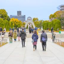 a group of people walking down the stairs in a park