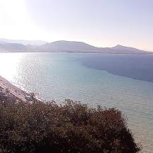a view of a beach with mountains in the distance